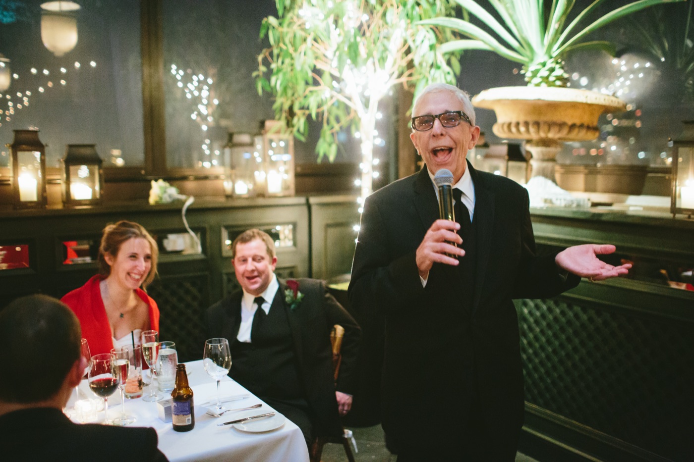 Sebastian giving a toast at a wedding reception
